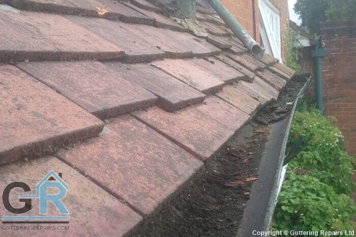 Roof and guttering on a domestic property in need of guttering and roof repairs. Gutter Repairs Ltd